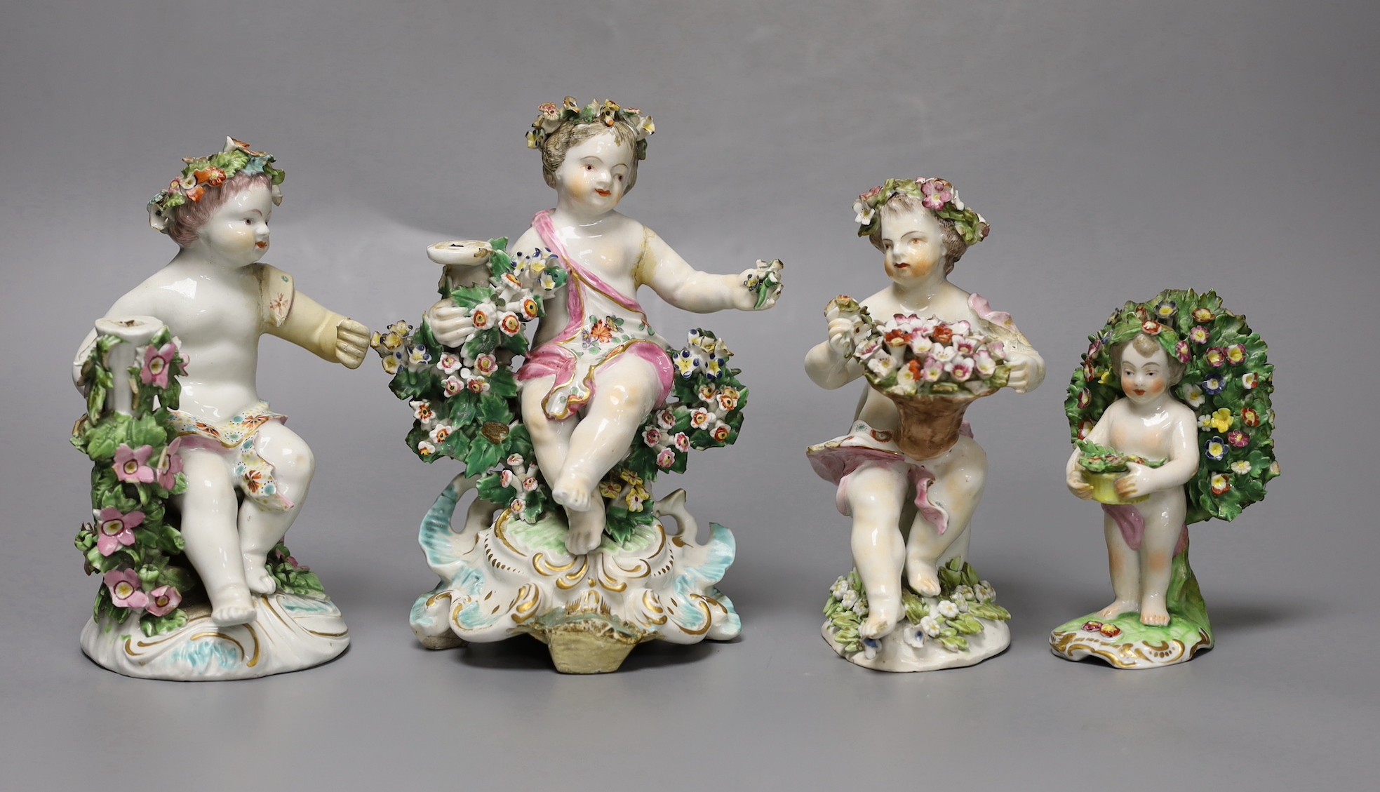 Three 18th century Derby porcelain putti (a.f) and another later continental putti, tallest 17cm